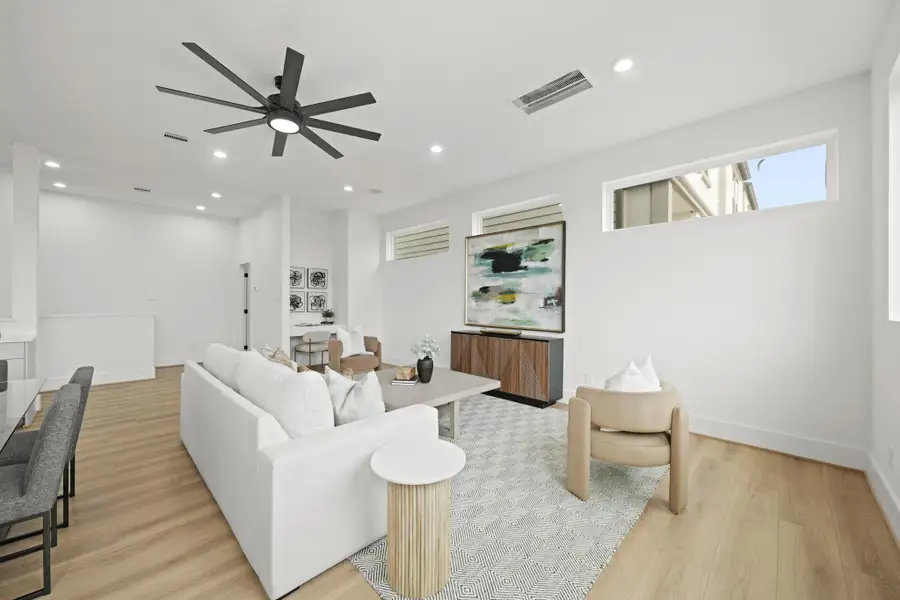 Imagine relaxing or entertaining family and friends in the family room with transom windows, recessed lights and a ceiling fan with integrated light offering numerous furniture placement opportunities.