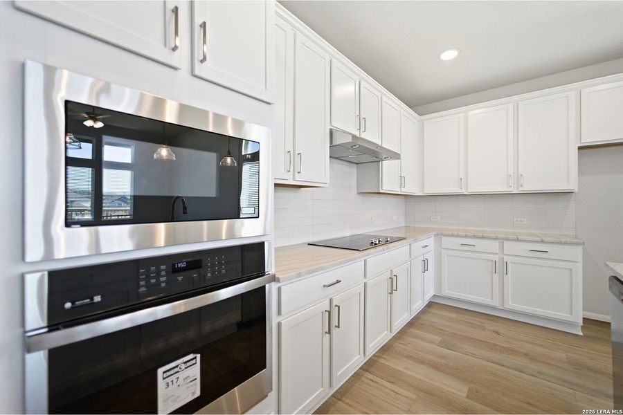 Furnished interior view inside a new home in The Woodlands at Medina Hills, Mico (Image 12).