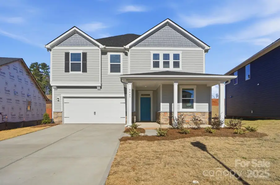 Front exterior of a new home in Wilson Creek, Indian Land, SC, highlighting curb appeal (Image 2). Front exterior of a new home in Wilson Creek, Indian Land, SC, highlighting curb appeal (Image 2).