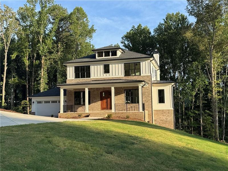 Front exterior of a new home in , Woodstock, GA, highlighting curb appeal (Image 29).