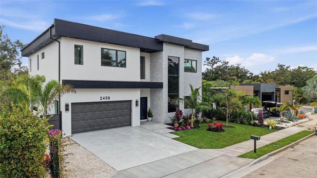 Front exterior of a new home in , Sarasota, FL, highlighting curb appeal (Image 1). Front exterior of a new home in , Sarasota, FL, highlighting curb appeal (Image 1).