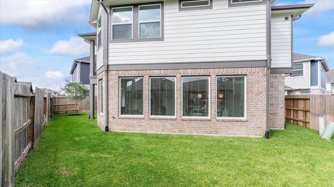 Exterior details and patio area of a home in Balmoral, Humble (Image 24).