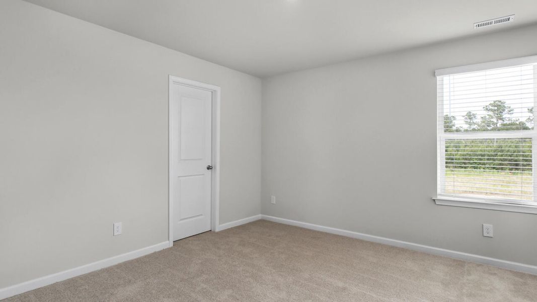 Spacious, unfurnished interior of a new home in Surfside Landing, Hubert (Image 29).