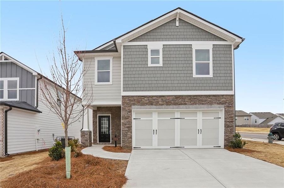 Front exterior of a new home in Hawthorne Station, College Park, GA, highlighting curb appeal (Image 1). Front exterior of a new home in Hawthorne Station, College Park, GA, highlighting curb appeal (Image 1).