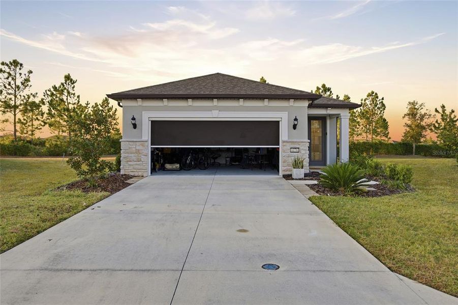 Front exterior of a new home in Del Webb Stone Creek, Ocala, FL, highlighting curb appeal (Image 2). Front exterior of a new home in Del Webb Stone Creek, Ocala, FL, highlighting curb appeal (Image 2).
