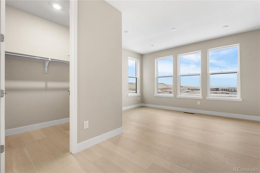Spacious, unfurnished interior of a new home in Autograph at Lyric, Lone Tree (Image 25).