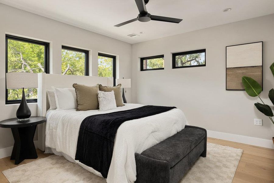 Bedroom featuring light wood-style floors and ceiling fan