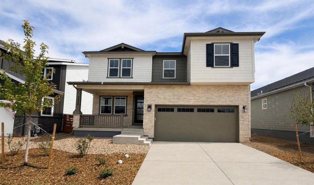 Front exterior of a new home in The Aurora Highlands, Aurora, CO, highlighting curb appeal (Image 2). Front exterior of a new home in The Aurora Highlands, Aurora, CO, highlighting curb appeal (Image 2).