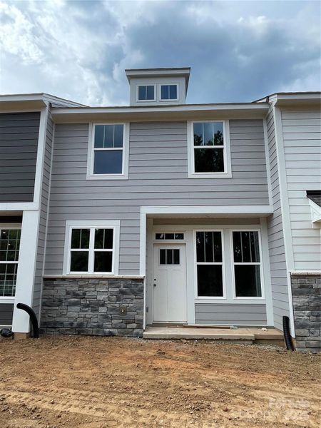 Front exterior of a new home in Greenway Overlook, Charlotte, NC, highlighting curb appeal (Image 1). Front exterior of a new home in Greenway Overlook, Charlotte, NC, highlighting curb appeal (Image 1).