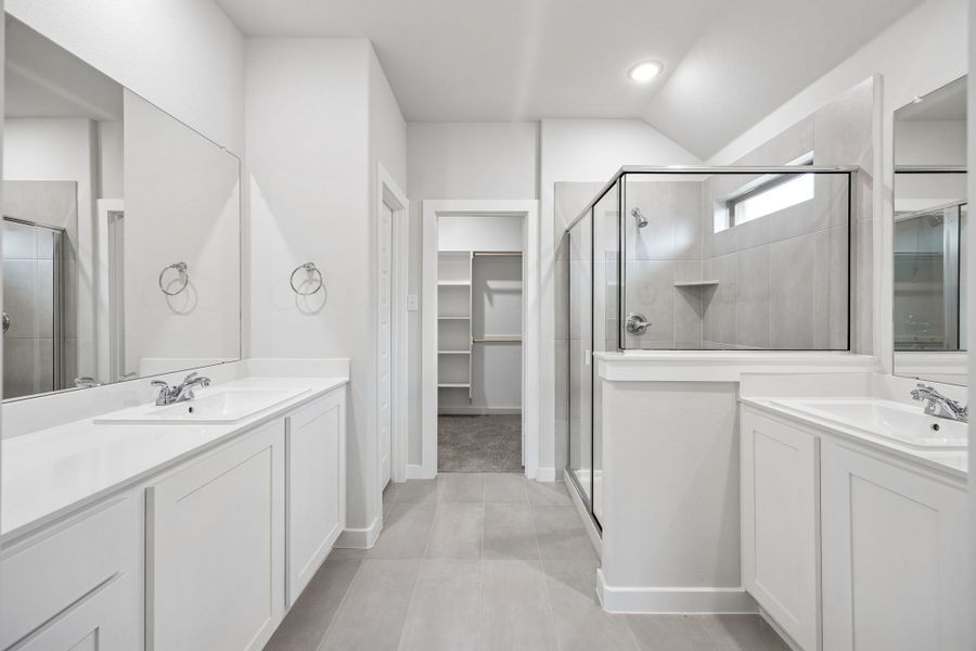 Primary Bathroom in the Heisman home plan by Trophy Signature Homes – REPRESENTATIVE PHOTO