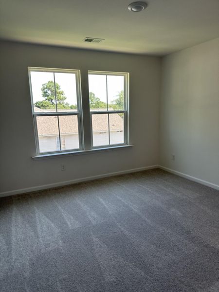 Spacious, unfurnished interior of a new home in Clear Springs Townhomes, North Charleston (Image 9).