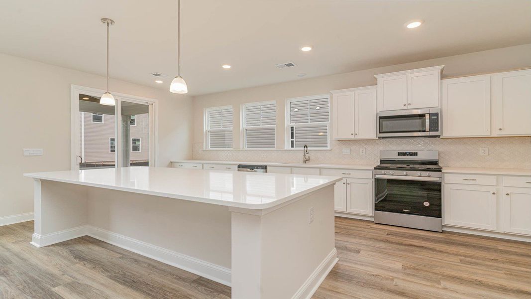 Representative furnished interior of a home built from the FORRESTER by D.R. Horton in Shell Pointe, Gilbert (Image 5).