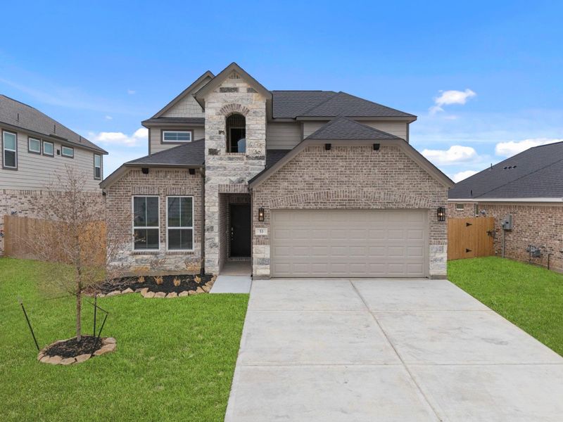 Front exterior of a new home in Beacon Hill, Waller, TX, highlighting curb appeal (Image 17). Front exterior of a new home in Beacon Hill, Waller, TX, highlighting curb appeal (Image 17).