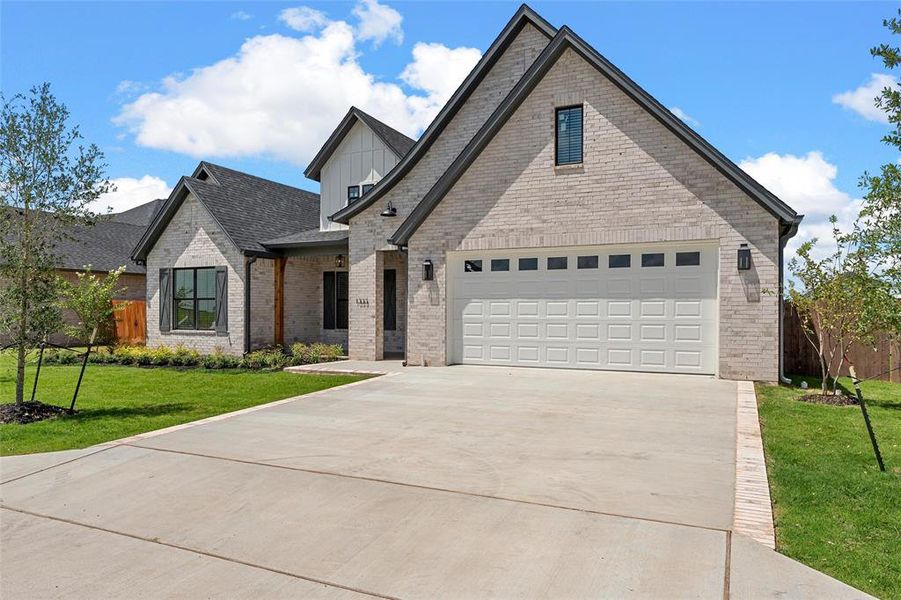 Front exterior of a new home in , Hewitt, TX, highlighting curb appeal (Image 24).