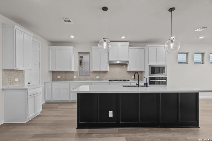 Furnished interior view inside a new home in Nopal Valley, San Antonio (Image 13).