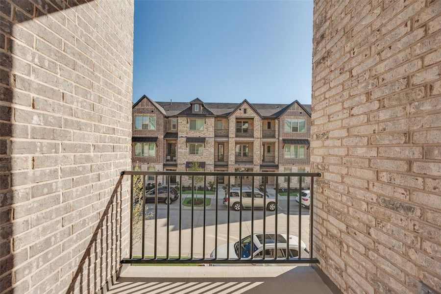 Exterior details and patio area of a home in Wade Settlement Townhomes, Frisco (Image 3).