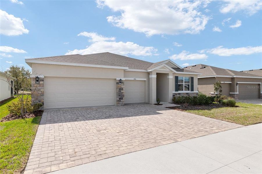 Front exterior of a new home in , Ocala, FL, highlighting curb appeal (Image 24).