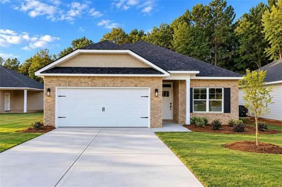 Front exterior of a new home in Canterbury Villas, Carrollton, GA, highlighting curb appeal (Image 1). Front exterior of a new home in Canterbury Villas, Carrollton, GA, highlighting curb appeal (Image 1).