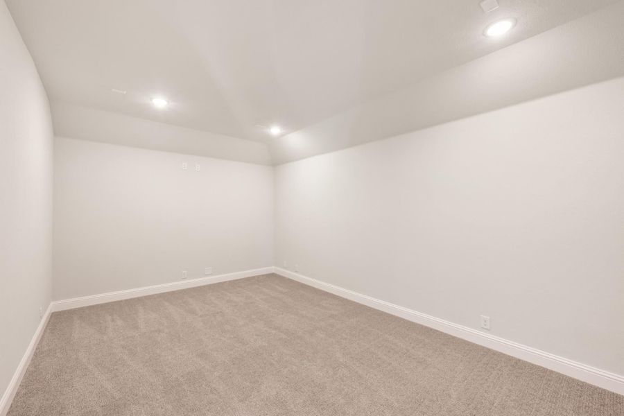 Empty room with white walls, beige carpet, and recessed ceiling lights Empty room with white walls, beige carpet, and recessed ceiling lights
