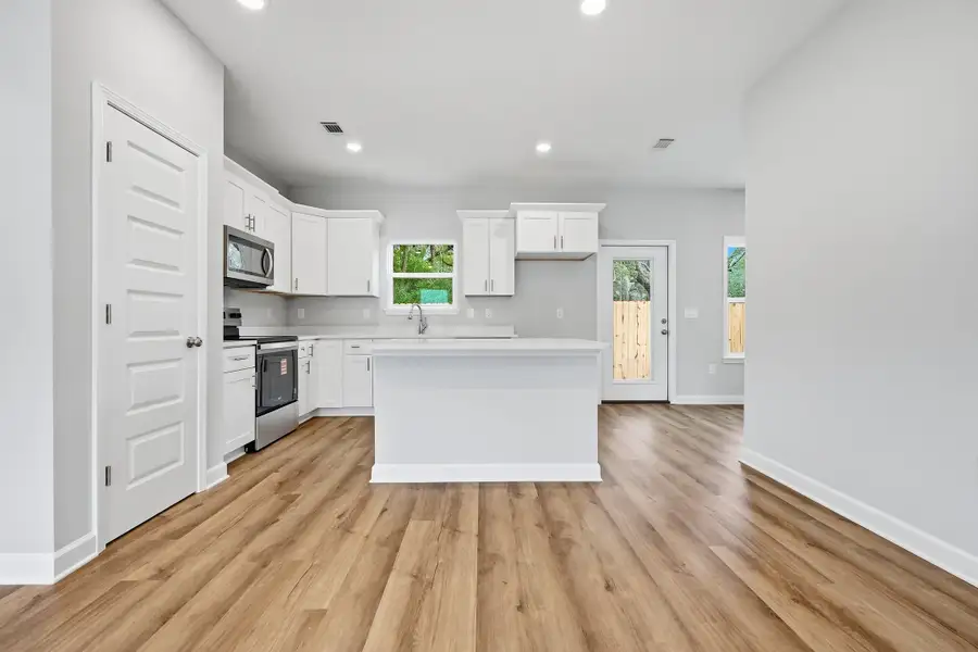 Furnished interior view inside a new home in Live Oak Cottages, Freeport (Image 8).