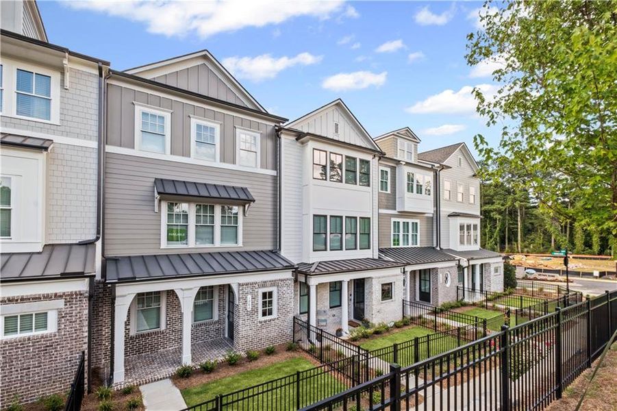 Front exterior of a new home in Devin's Shire, Kennesaw, GA, highlighting curb appeal (Image 22).