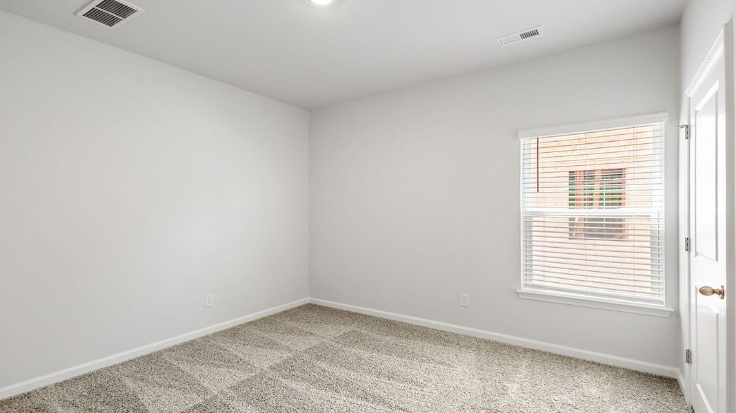Spacious, unfurnished interior of a new home in The Crossing at St. James, Summerville (Image 25).