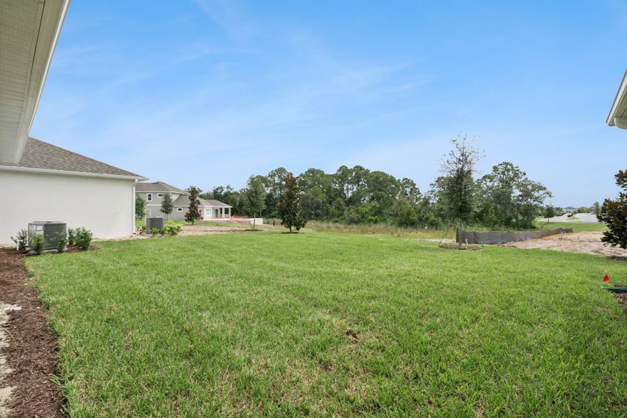 Exterior details and patio area of a home in Northlake at Ovation, Winter Garden (Image 22).