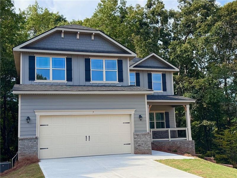 Front exterior of a new home in Magnolia Villas, Cornelia, GA, highlighting curb appeal (Image 20). Front exterior of a new home in Magnolia Villas, Cornelia, GA, highlighting curb appeal (Image 20).
