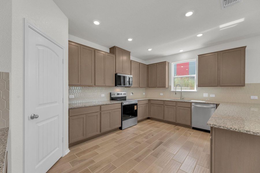 Furnished interior view inside a new home in Mustang Valley, Manor (Image 16).
