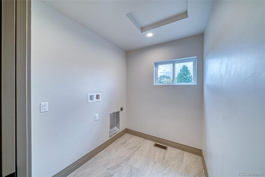 Laundry room is conveniently located upstairs where all the bedrooms are.