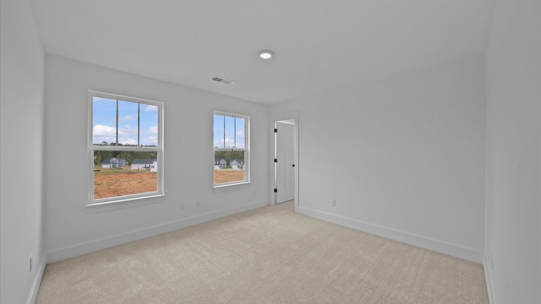 Vibrant and restful bedroom with oversized windows, refined detail, and a warm, welcoming atmosphere Vibrant and restful bedroom with oversized windows, refined detail, and a warm, welcoming atmosphere