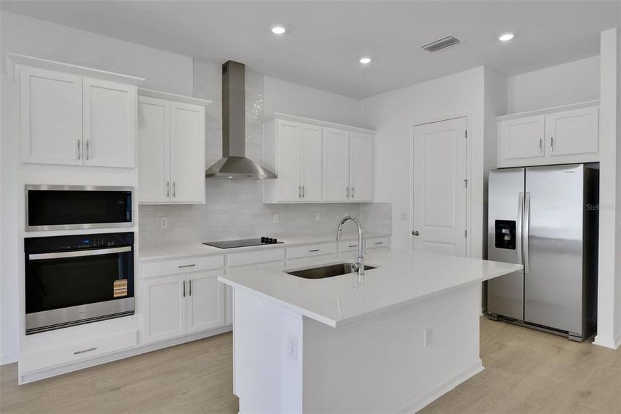Furnished interior view inside a new home in Serenade at Ovation, Winter Garden (Image 14).