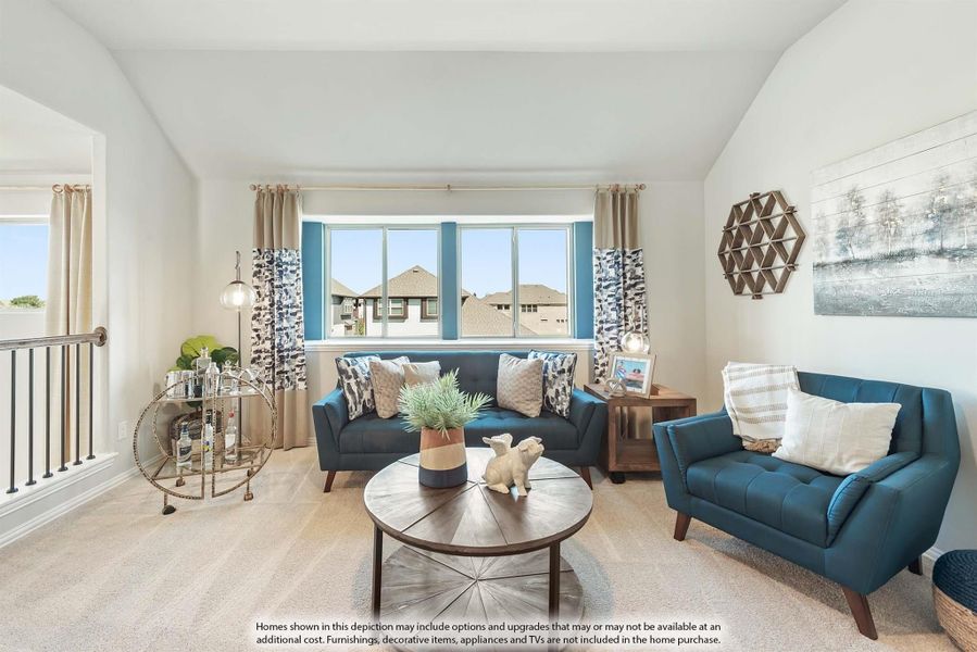 Living room with blue sofa and armchair, round wood coffee table, large window, and carpet flooring Living room with blue sofa and armchair, round wood coffee table, large window, and carpet flooring
