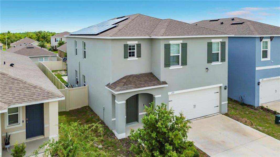 Front exterior of a new home in , Davenport, FL, highlighting curb appeal (Image 2). Front exterior of a new home in , Davenport, FL, highlighting curb appeal (Image 2).
