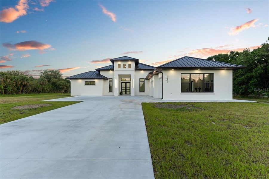 Front exterior of a new home in , Palm Bay, FL, highlighting curb appeal (Image 21). Front exterior of a new home in , Palm Bay, FL, highlighting curb appeal (Image 21).
