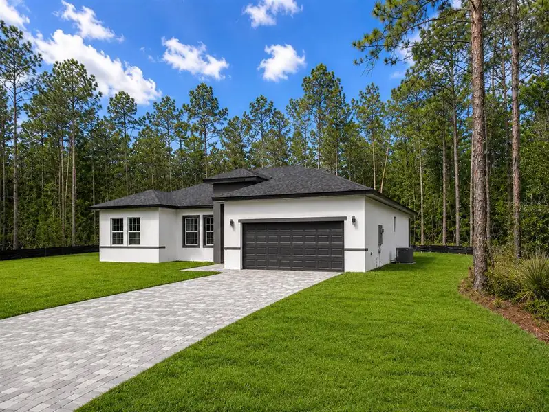 Front exterior of a new home in , Ocala, FL, highlighting curb appeal (Image 20).