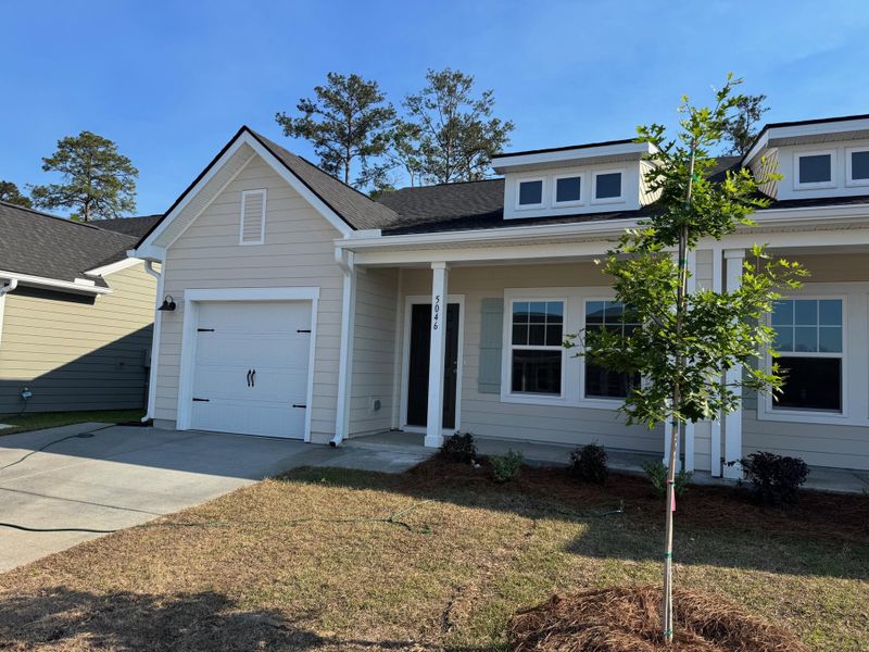 Front exterior of a new home in , Ravenel, SC, highlighting curb appeal (Image 19).