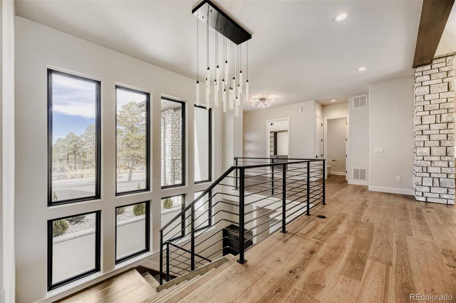 Stairs to lower level and front windows