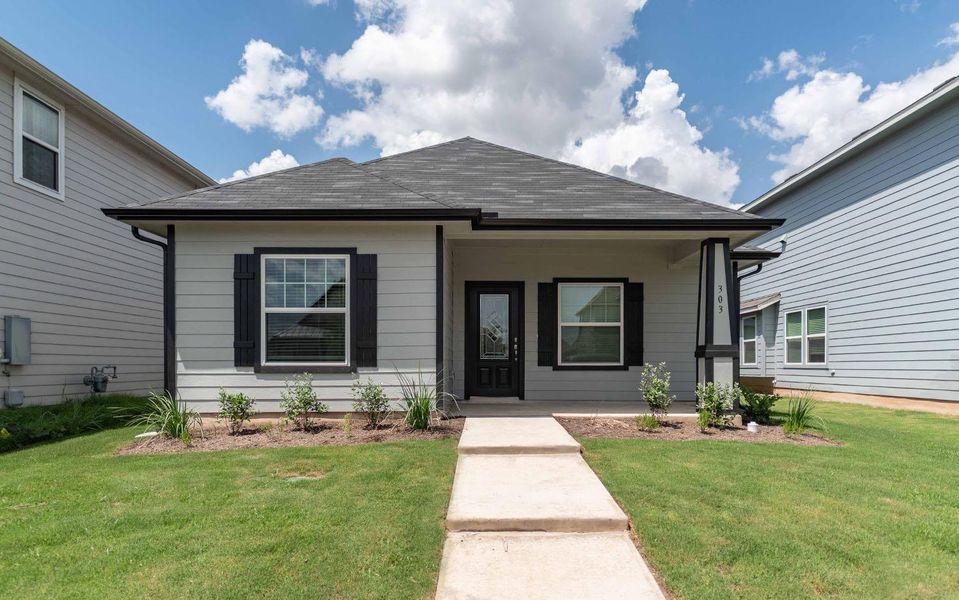 Front exterior of a new home in Brooklands, Hutto, TX, highlighting curb appeal (Image 1). Front exterior of a new home in Brooklands, Hutto, TX, highlighting curb appeal (Image 1).