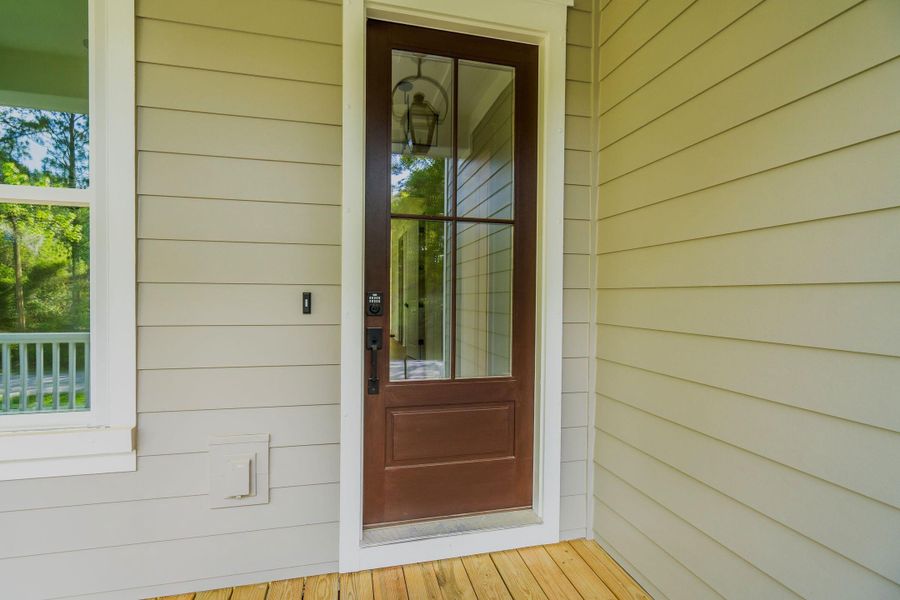 Exterior details and patio area of a home in , Johns Island (Image 36).