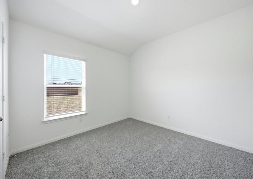 Carpeted secondary bedroom featuring a window with natural light. Carpeted secondary bedroom featuring a window with natural light.