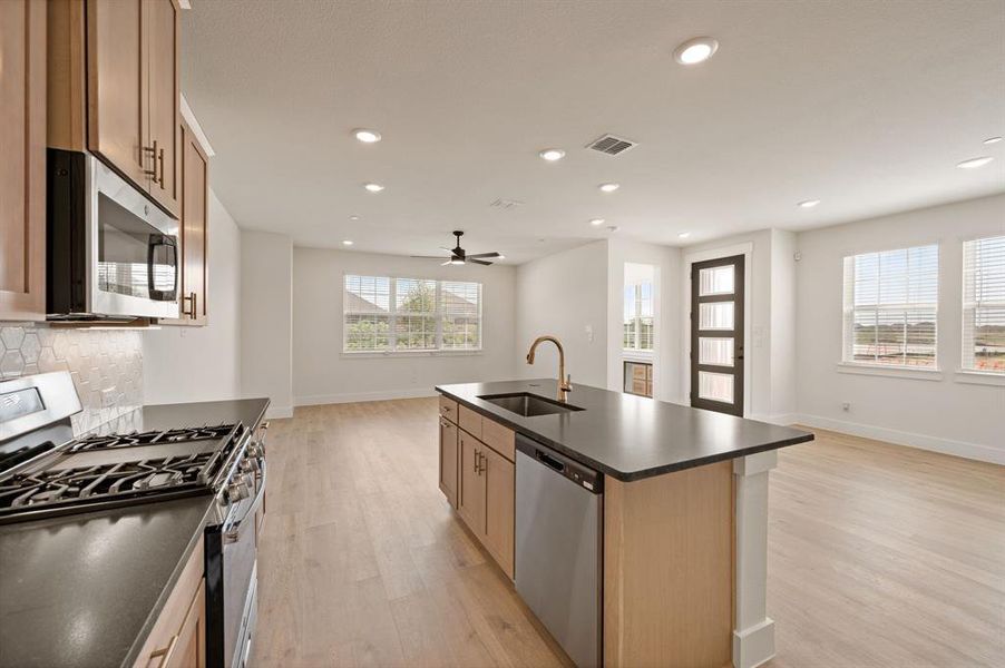Featuring stainless appliances and thoughtful design elements, this kitchen is one for the books!