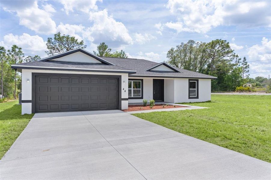 Front exterior of a new home in , Ocklawaha, FL, highlighting curb appeal (Image 19).
