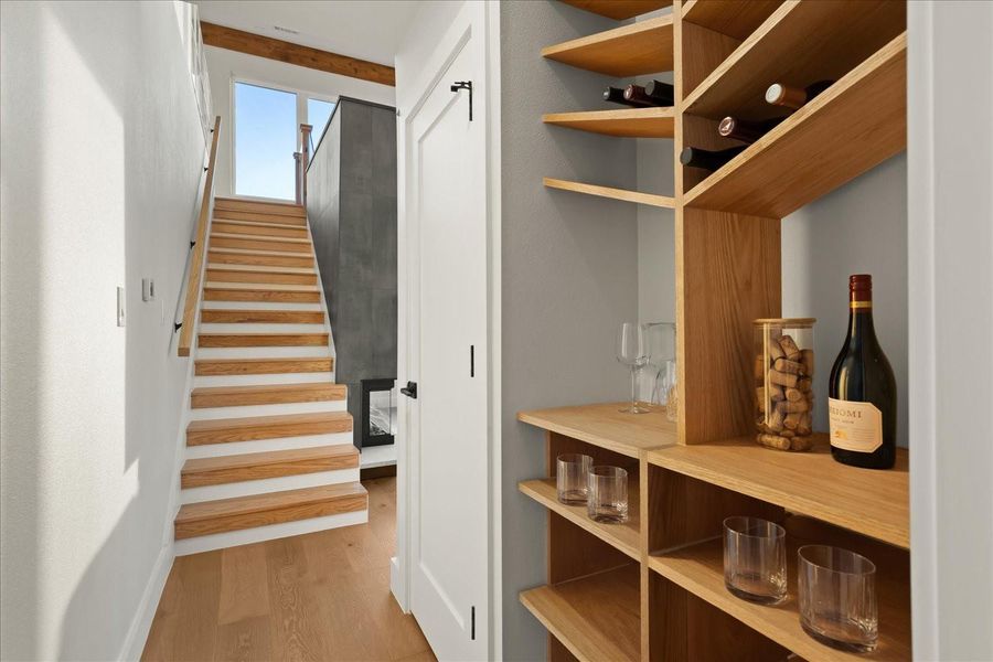 Main house, second level: Hall near kitchen and stairs to third floor loft.