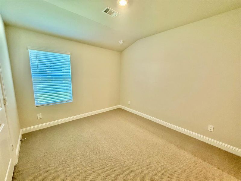 Neutral-toned room featuring a single window with blinds, recessed lighting, wall-to-wall carpeting, and white baseboards Neutral-toned room featuring a single window with blinds, recessed lighting, wall-to-wall carpeting, and white baseboards