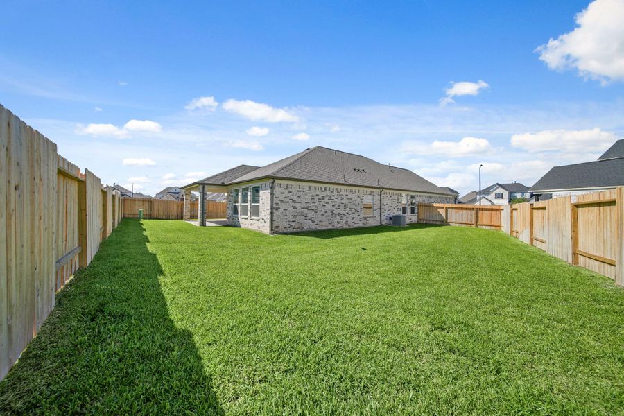 Exterior details and patio area of a home in Beacon Hill, Waller (Image 15). Exterior details and patio area of a home in Beacon Hill, Waller (Image 15).