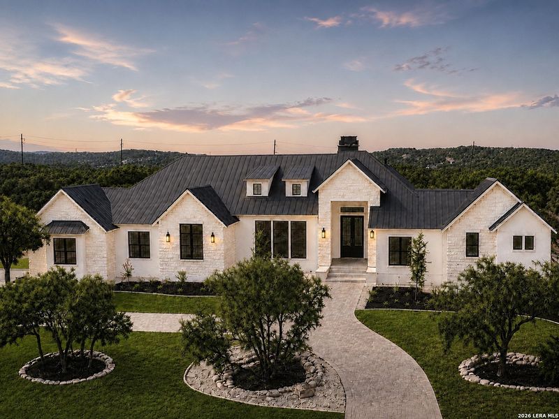 Front exterior of a new home in , Boerne, TX, highlighting curb appeal (Image 30). Front exterior of a new home in , Boerne, TX, highlighting curb appeal (Image 30).