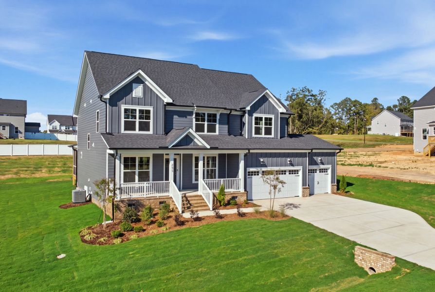 Front exterior of a new home in Browning Stables, Wendell, NC, highlighting curb appeal (Image 26).