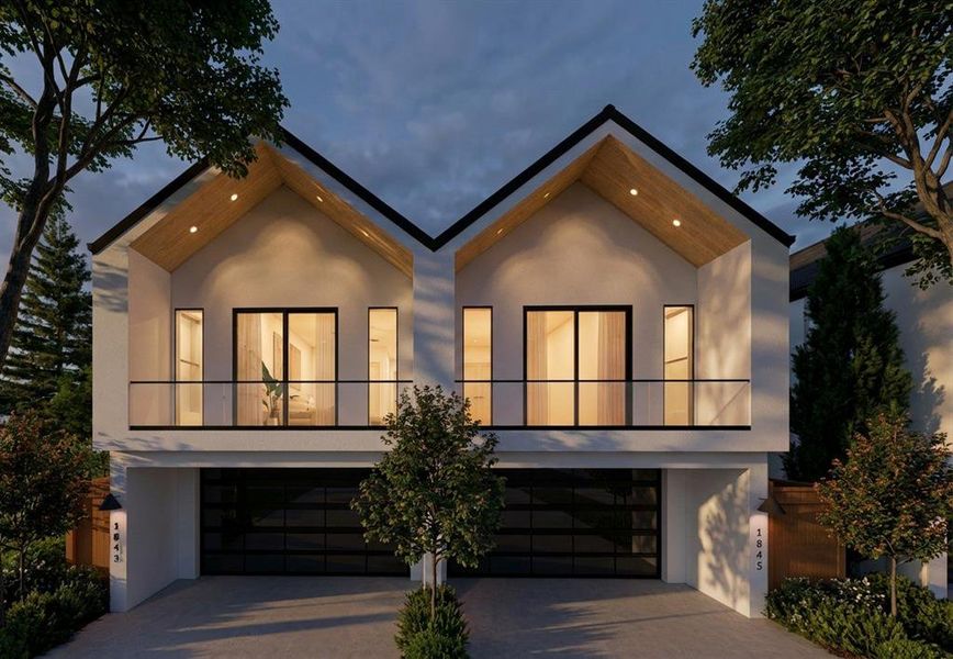 Modern home with a balcony, decorative driveway, stucco siding, and an attached garage