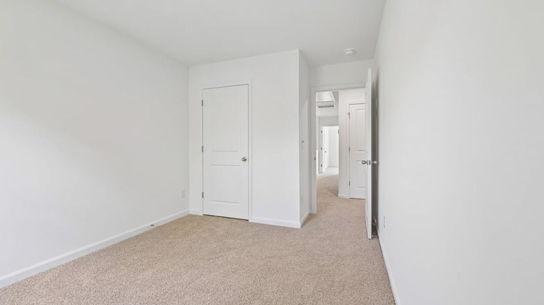 Spacious, unfurnished interior of a new home in The Townes at Belle Grove, Wendell (Image 17).